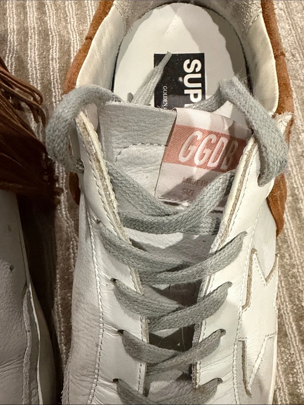 Golden Goose Women’s White Nubuck Low Top Super Star with Brown suede fringe.